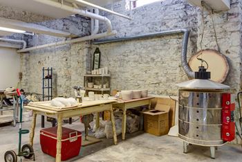 Pottery studio including fully-vented kiln